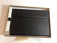 Keyboard case kit in open retail tray with cable compartment visible