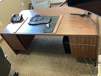 front perspective showing desktop surface, drawer pedestal, keyboard tray