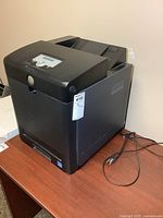 Front and side view of Dell 3130cn printer with cable