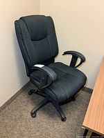 Front view of black fabric office chair showing overall design