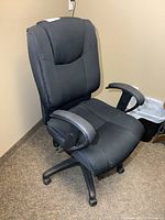Front-angled view of black fabric adjustable office chair