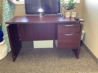 Front view of desk showing overall structure and drawers