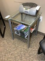 Front view of side table with glass top and lower shelf