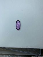 Front view of elongated oval faceted amethyst