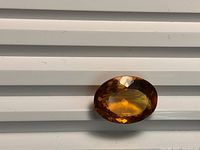 Front view of faceted oval citrine