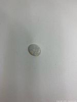 Top view of oval opal showing body tone and play-of-color