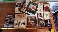 Group shot of ten books on antique furniture, restoration and folk art
