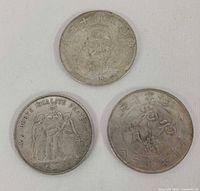 Obverse of Yuan Shikai 1 Yuan, obverse of France 10 Francs, reverse of Kirin 7 Candareens