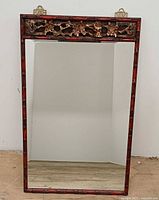 Full front view of mirror showing entire frame and glass