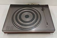 Top view showing platter, buttons, tonearm, dust cover closed