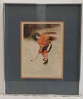 Full view of framed lithograph with mat and frame