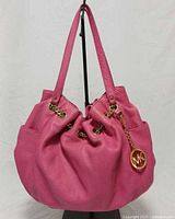 Front view of pink Michael Kors Fulton hobo