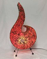 Lamp lit, front view showing wood ring construction and red glow