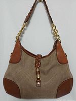 Front view of Michael Kors canvas/leather handbag