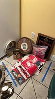 Group shot showing Schmidt's tray, Pabst barrel plaque, Seagrams art, Bronco Pump box, bagged items