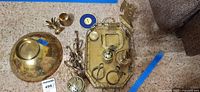 Group shot showing all brass items together on carpet