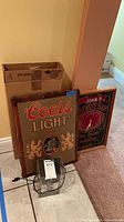 Group shot showing Coors Light clock, Private Bar clock, Miller Lite clock and box with clock kit