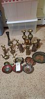 Group shot showing all brass vases, ewers and enameled dishes