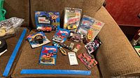Overview of all packaged and loose cars on couch