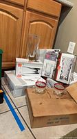 RCR boxed crystal sets, vase, punch cup case on floor