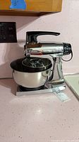Full view of Sunbeam Mixmaster 2359 stand mixer with bowl on countertop