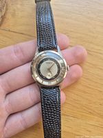 Front view showing dial, case and strap