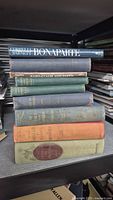Stack of nine Napoleon books on shelf