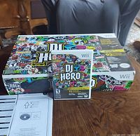 Retail DJ Hero Wii box front with game case
