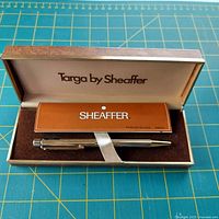 Pen and case with booklet in open presentation box