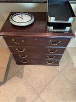 Top view of cabinet with clock and two letter trays