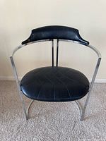 Front view of chrome frame chair with black seat