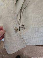 Close-up of jacket clasp and fabric texture