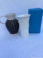 Both ceramic pieces and box together