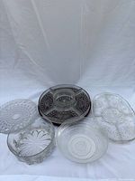 All five clear pressed glass serving pieces grouped