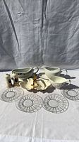 Group shot of gravy boats, glass plates, shakers, leaf bowl