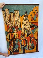 Full view of tapestry front showing design and hanging dowels