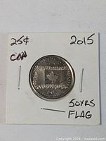 Obverse side of 2015 Canadian flag 25-cent coin in 2×2 holder showing inscriptions and design