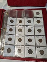 Full binder page showing 18 coins in 3×6 grid inside plastic sleeve