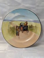 Front view of entire plate showing painted carriage scene