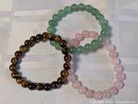 All three gemstone bracelets arranged together