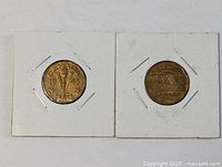 Front view of both coins in holders