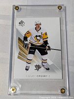 Front view of Sidney Crosby SP Authentic card in screw-down holder