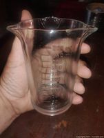 Side view showing graduated markings up to 250 ml and overall form