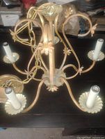 Full view of chandelier with five arms and canopy