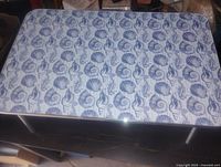 Top view showing seashell pattern surface and overall shape