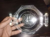 Top view showing full plate, handles, pear motif