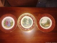 Three plates face up on table showing design details