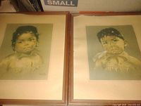 Front view of both framed portrait prints