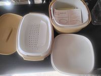 Steamer pieces and Multi-Server base shown open with instruction leaflet visible