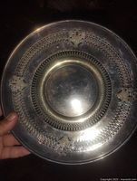 Front view showing entire decorative silver-plated plate